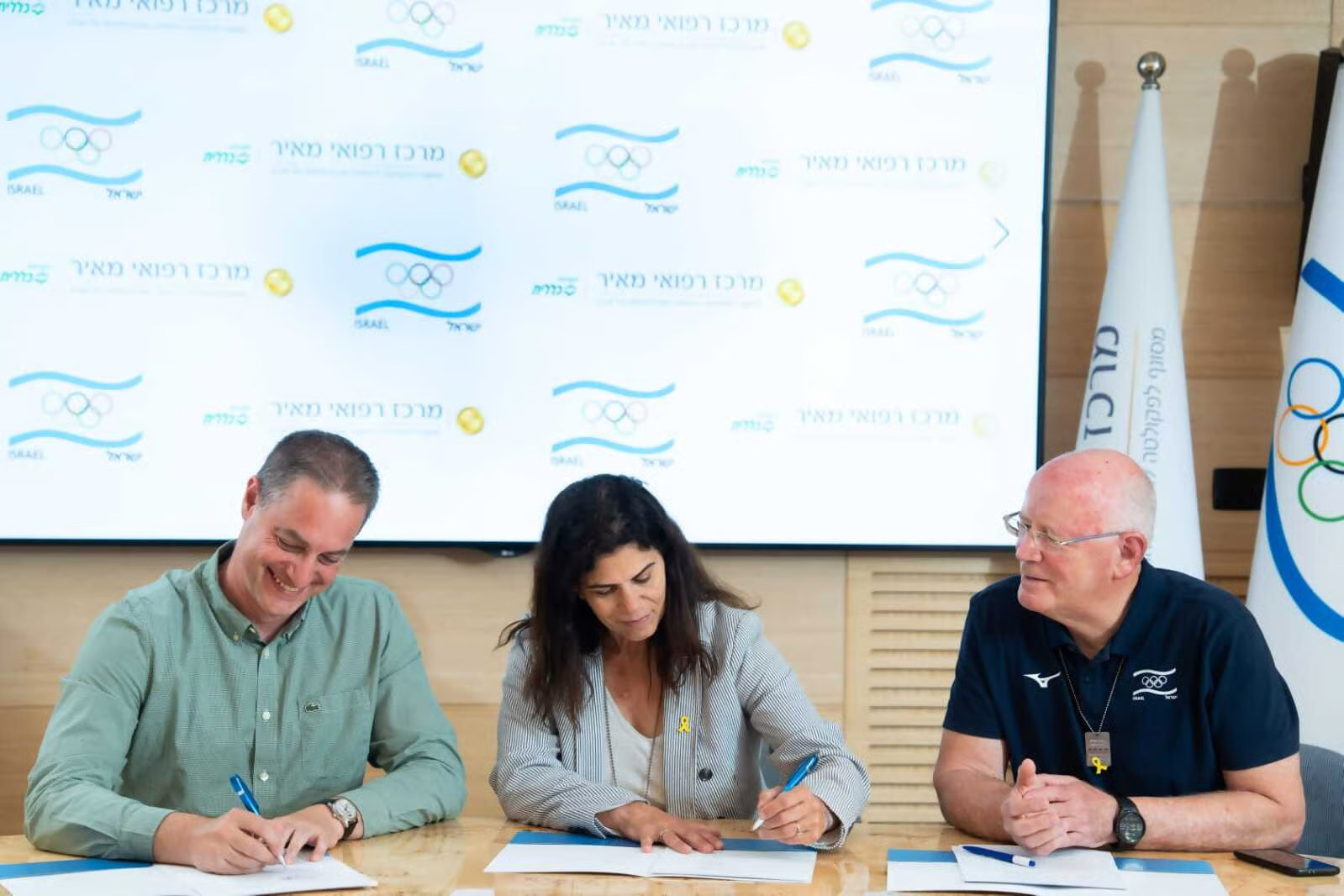 Signing the partnership agreement with the Israeli Olympic Committee
